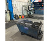 SSD Self Dumping Bin with wheels collecting steel waste in manufacturing facility
